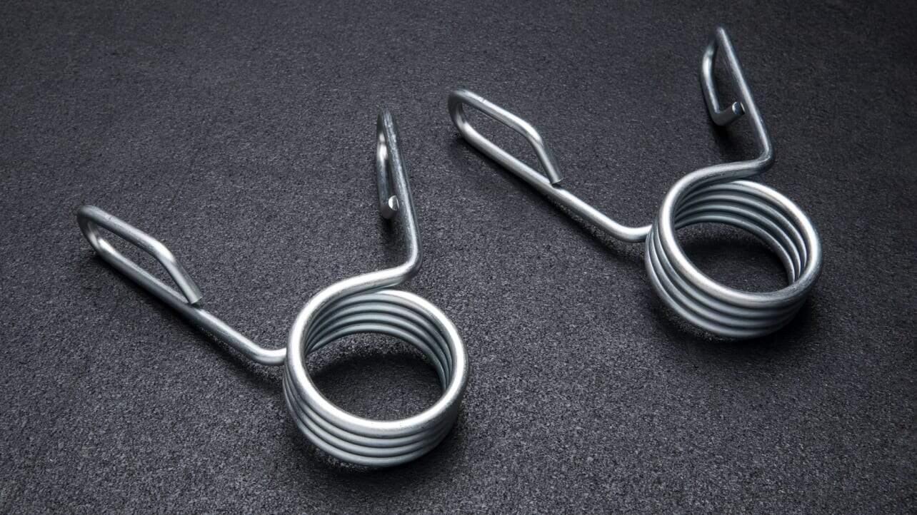 Rogue USA barbell collars revolutionize gym performance. But are they truly superior to aluminum options? Dive in to find out!